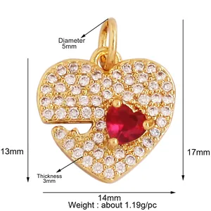Detailed view of heart-shaped gold-plated pendant with sparkling red and white zircons