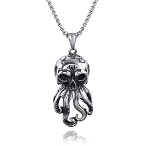 Polished silver octopus skull pendant on square chain necklace over white background