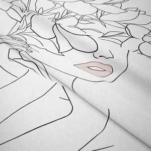 Detail of soft fabric texture featuring minimalist black line art of a floral female face
