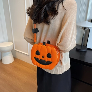 Stylish orange pumpkin crossbody bag with black bat accents for Halloween outfits
