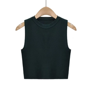 Detailed view of the dark green knit cropped tank top showing the ribbed texture and round neck