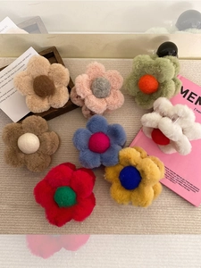 Cute plush daisy claw clips in eight colors for girls' hair styling and buns