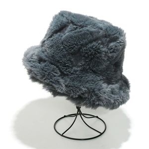 Detailed view of the dark grey plush faux fur bucket hat with soft shaggy texture