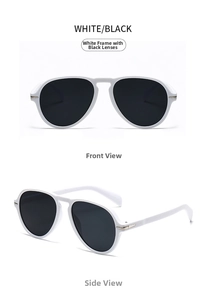 Close-up of white pilot sunglasses featuring dark grey lenses and gold arrow hinges
