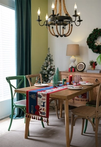 Close-up of Christmas table runner with red and blue splicing and decorative tassels
