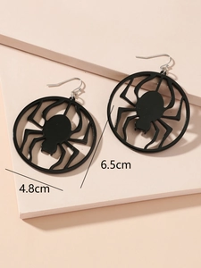 Detail showing dimensions of black spider halloween earrings on a pink geometric stand