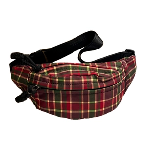Kids plaid crossbody chest bag in red and green tartan with adjustable black strap