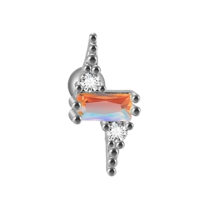 Close-up of lightning bolt earring with blue zircon and stainless steel chain detail