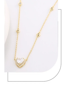 Detailed close-up of S925 silver heart necklace with zircon pendant and gold chain