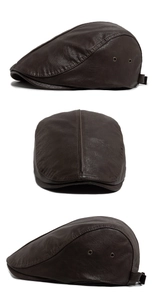Detail view of dark brown PU leather beret with stitching and metal eyelets