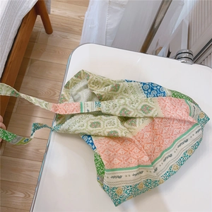 Detailed top view of patchwork floral canvas tote bag with colorful cotton prints