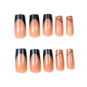 Classic black French tip press-on nails with heart patterns on medium square fake nails