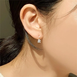 925 sterling silver hoop earrings with square cubic zirconia on a female model
