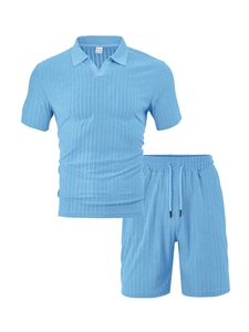 Detail of the crewneck collar and vertical stripe texture on a light blue sports set