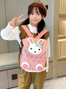 Pink canvas toddler backpack with blue polka dots and a plush bunny head detail