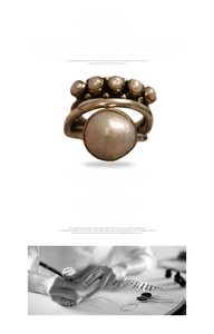 Detailed view of vintage large pearl open ring with smaller pearl accents and aged finish