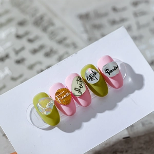 3D nail stickers with metallic English text on green and pink gradient nail plates