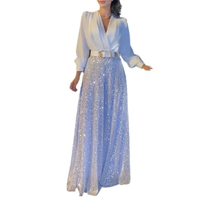 Women's V-neck white long sleeve top with silver sequined high waist maxi skirt and belt