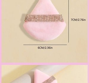 Pink triangular powder puff with rhinestone strap detail and 7cm x 6cm size dimensions