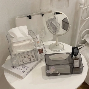 Transparent acrylic tissue box with side storage slots and butterfly detail for tabletop