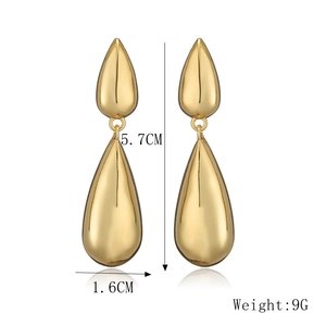 Detail view of gold waterdrop tassel earrings with size dimensions 5.7cm by 1.6cm