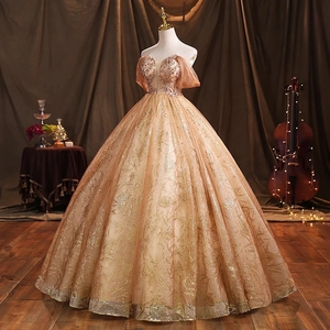 Elegant champagne gold off-the-shoulder evening gown with sequined bodice and mesh skirt