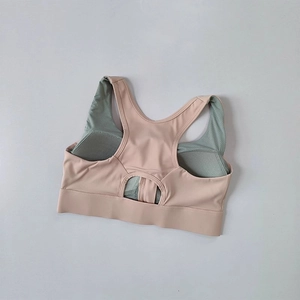 Detail of high-support sports bra featuring racerback cutout and mesh lining