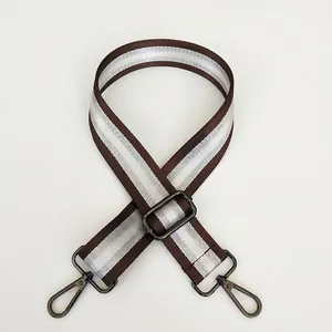 Detail of adjustable 3.8cm striped nylon bag strap with gunmetal swivel hooks