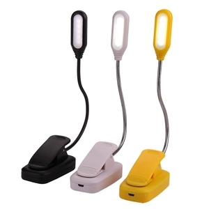 Adjustable LED clip-on desk lamps in black, white and yellow colors with flexible hose