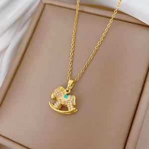 Luxury gold titanium rocking horse pendant necklace with sparkling pavé crystals