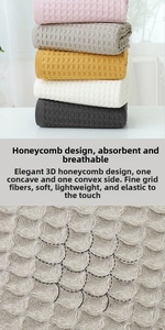 Close-up of pink, gray and yellow cotton bath towels with absorbent 3D honeycomb weave