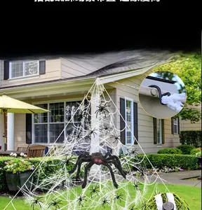 Outdoor Halloween decor set featuring a giant plush spider and large white triangular web