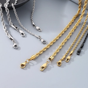 Detail of twisted rope anklets in gold, silver, and black finish with lobster clasps