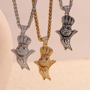 Three 18K gold plated stainless steel ghost pendants with braided chains in gold and silver
