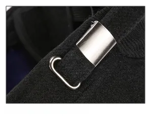 Detail of adjustable metal buckle on black wool flat cap for size adjustment