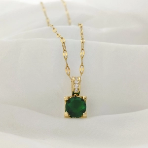Elegant gold necklace with square green gemstone pendant and micro-set cubic zirconia details