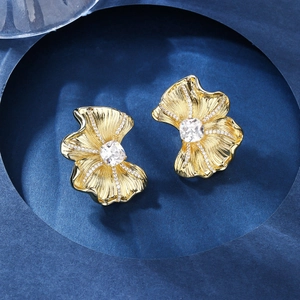 Irregular ginkgo leaf earrings in 18K gold plating with large white zircon accents