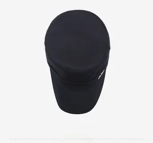 Top view of dark blue cotton flat top military cap with fine stitching and metal detail
