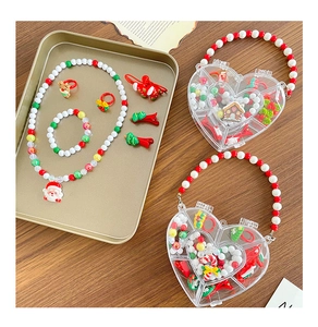 Detailed set of Christmas kids jewelry featuring Santa charms and beaded box case