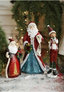 Detailed view of hand-painted resin Santa Claus and elf figurines with festive decor
