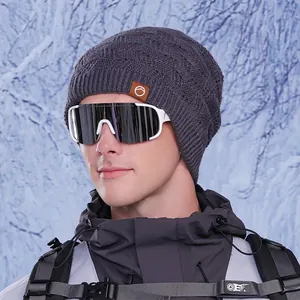 Winter thermal knit beanie for women in dark grey with fleece lining and ear protection