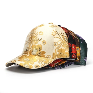 Detailed embroidery view of ethnic floral baseball caps in premium cotton and gold thread