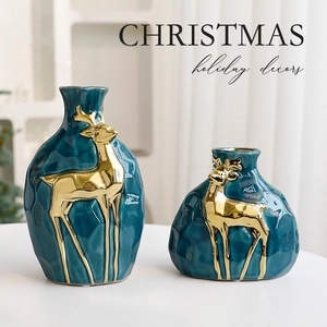 Set of two dark blue ceramic Christmas vases with golden reindeer relief and hammer texture
