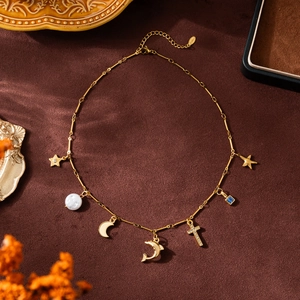 18K gold plated stainless steel necklace with star, moon, cross and dolphin charms