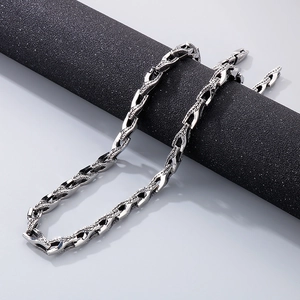 Detailed view of silver stainless steel snake bone chain with intricate scale textures