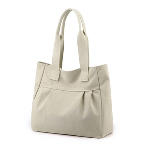 Minimalist beige canvas shoulder bag with pleated design and external pocket on white background