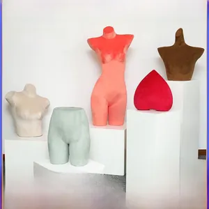 Detailed view of colorful velvet underwear mannequins and bust displays for shop display