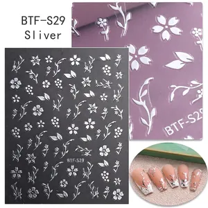 Macro shot of 3D embossed silver cherry blossom self-adhesive nail art stickers