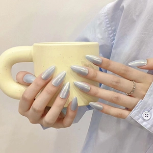 Minimalist light blue chrome almond press-on nails with iridescent pearly finish