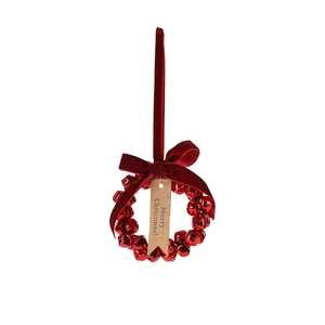 Christmas wreath ornament with red metal bells and a velvet bow on white background